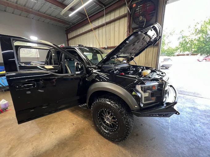 Truck in the bay for hail damage assessment and repair at Westway Collision Center in Carrollton, TX