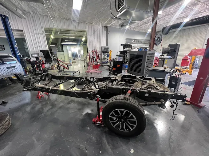 Vehicle frame straightening on the computerized frame machine at Westway Collision Center in Carrollton, TX