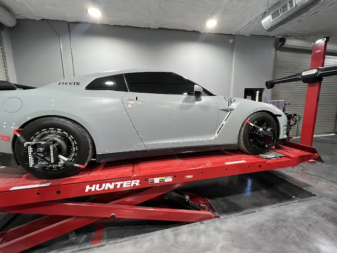 Nissan GT-R with measuring targets during ADAS calibration at Westway Collision Center in Carrollton, TX