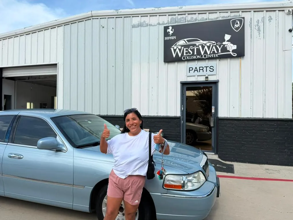 Happy customer taking delivery at Westway Collision Center in Carrollton, TX